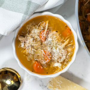 chicken cabbage soup topped with parmesan