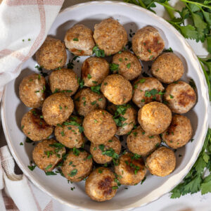 baked turkey meatballs with parsley garnish