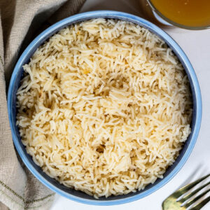 a blue bowl of bone broth rice
