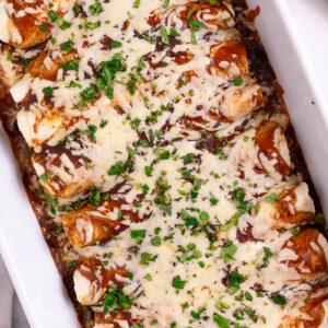 ceramic pan of bbq pulled pork enchiladas