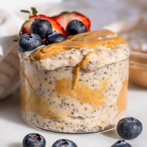 creamy peanut butter overnight oats topped with peanut butter and berries