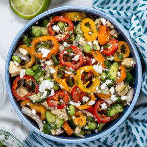bell pepper salad with chicken garnished with cilantro and feta cheese